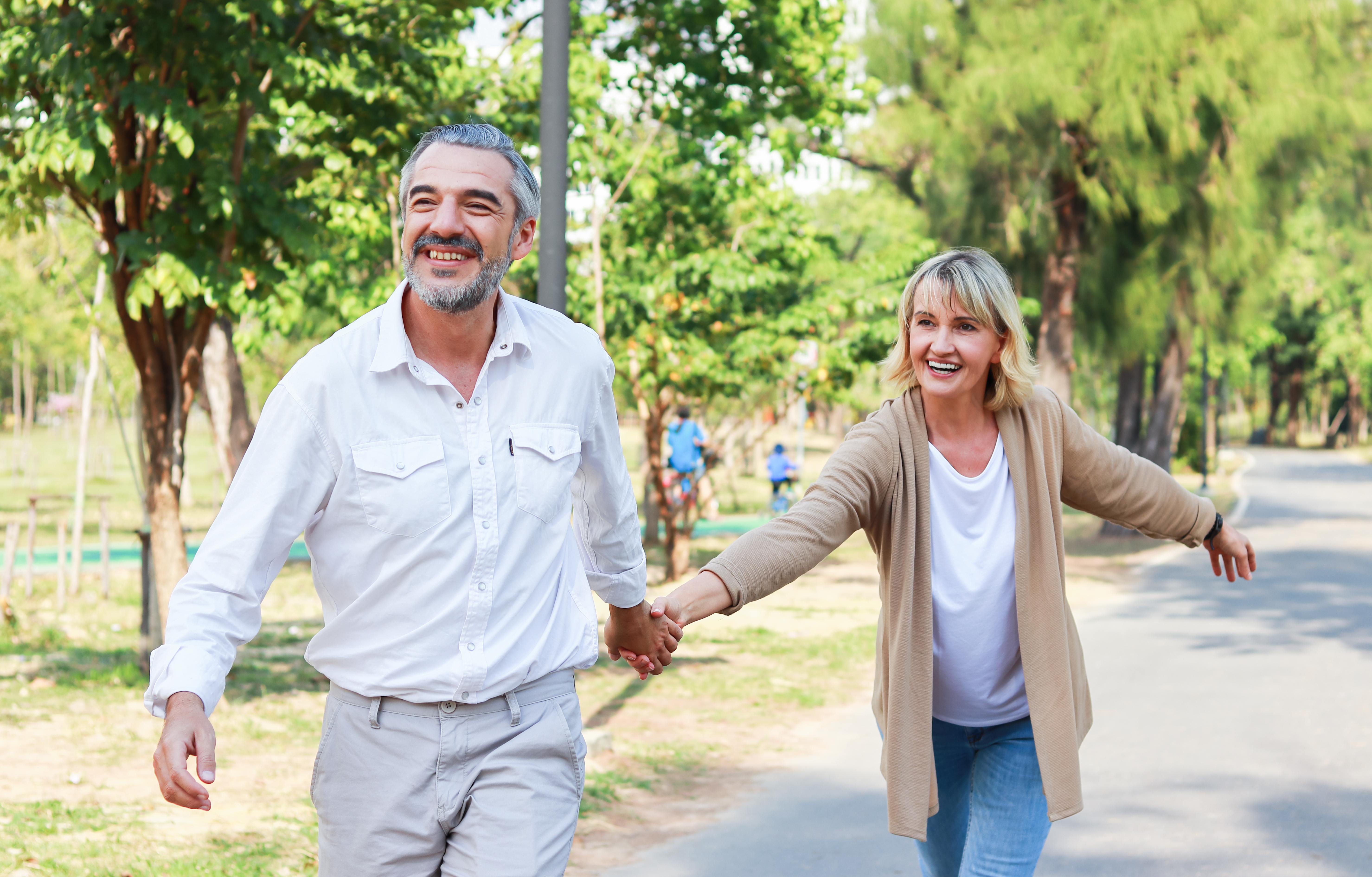 Happy older couple walking together, representing new beginnings
